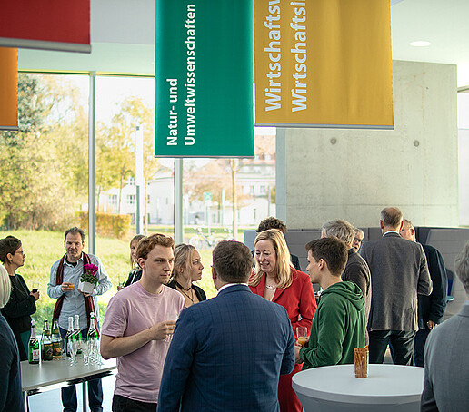 Guests at the event are engrossed in conversation.
