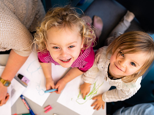 Two kindergarten children as a symbol of childhood education in times of the coronavirus pandemic.